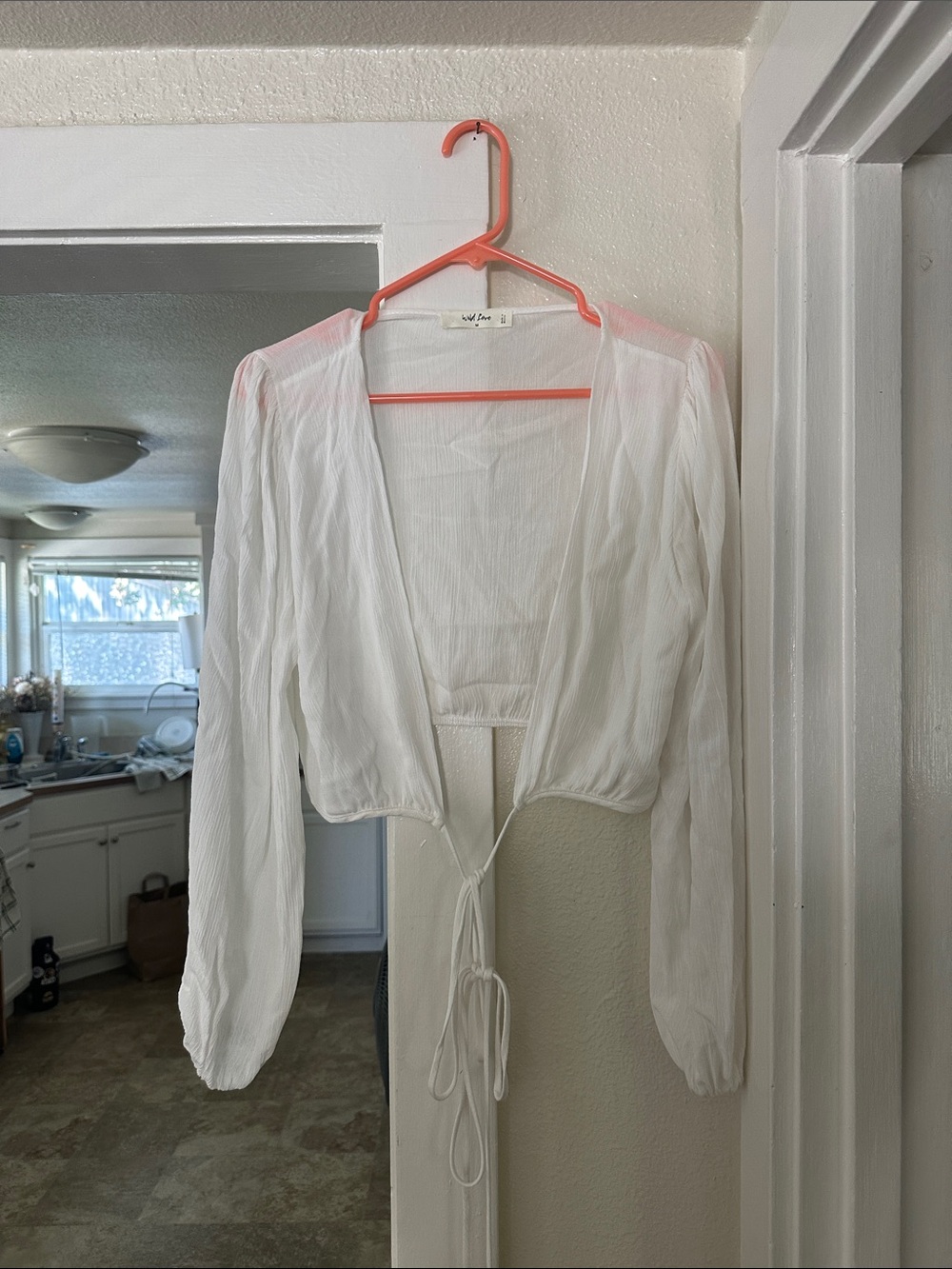 Sheer white wrap blouse. Size medium